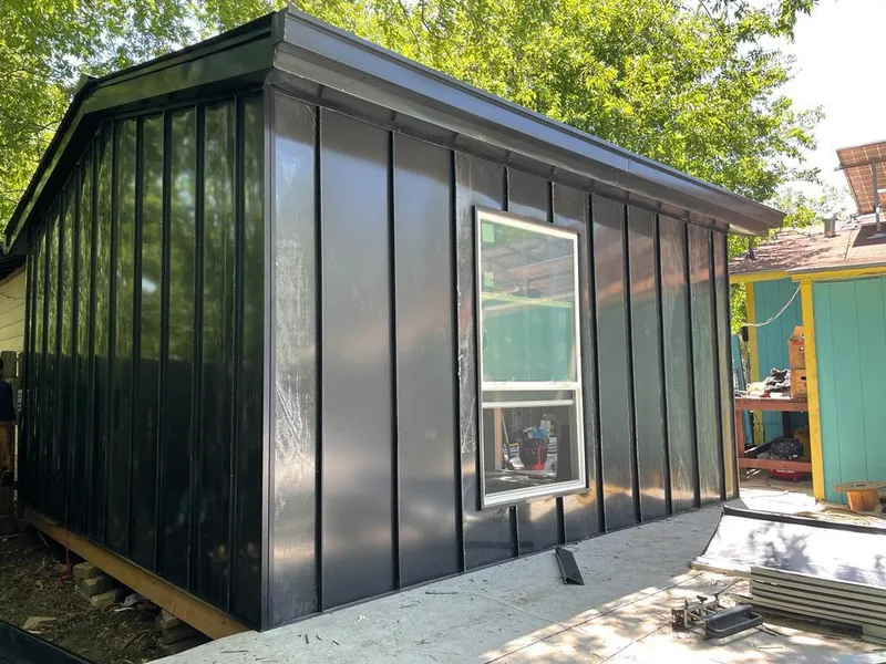 Black standing seam metal wall panels for Roof Inspection in Peculiar